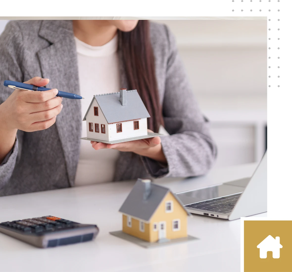 Real estate agent showing house model